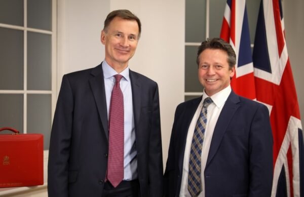 The government is committed to making property tax change, says Tory MP