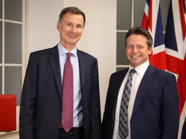 The government is committed to making property tax change, says Tory MP