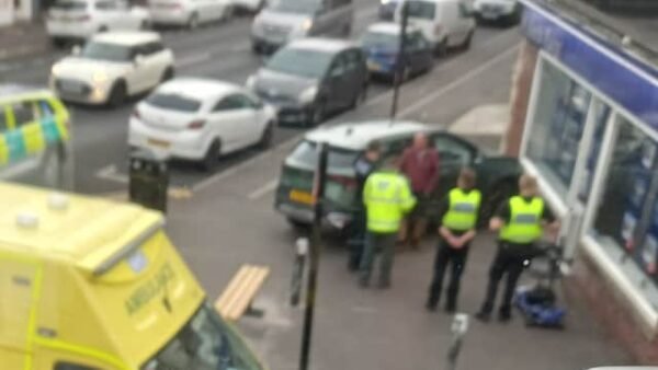Shock as car crashes into front of estate agency branch
