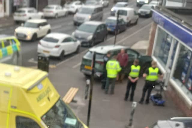 Shock as car crashes into front of estate agency branch