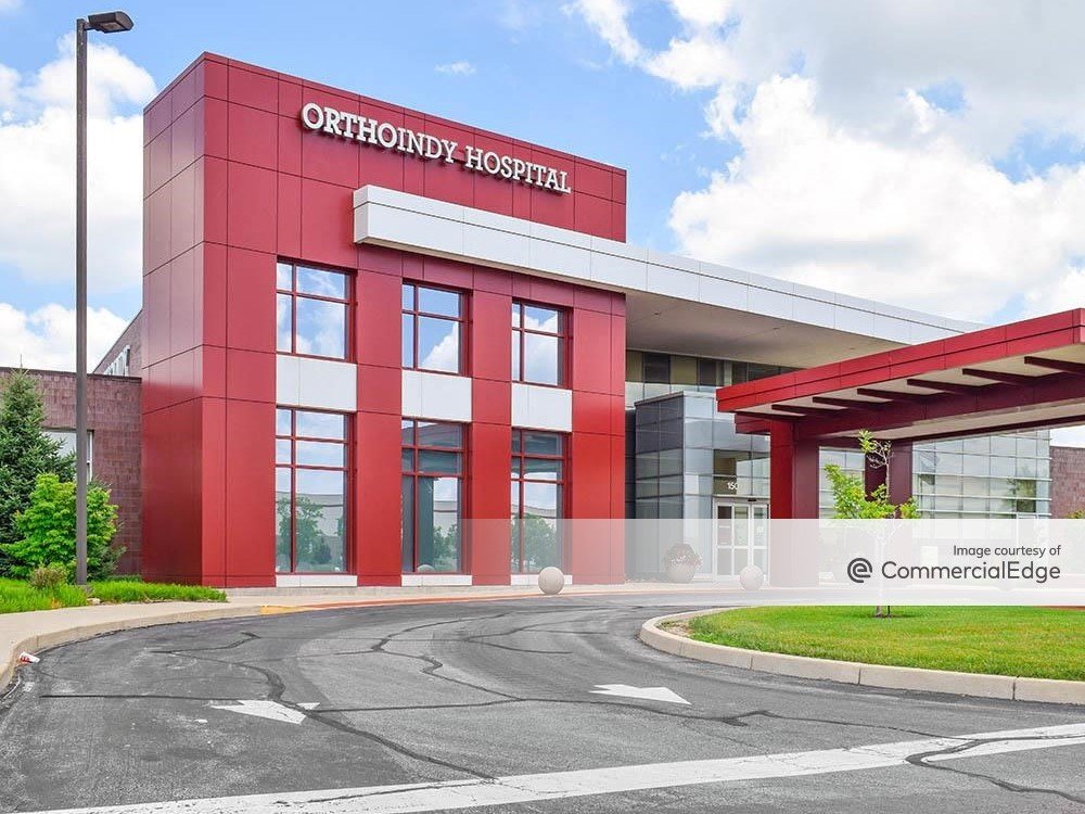 Exterior shot of OrthoIndy South, a two-story building with red façade.