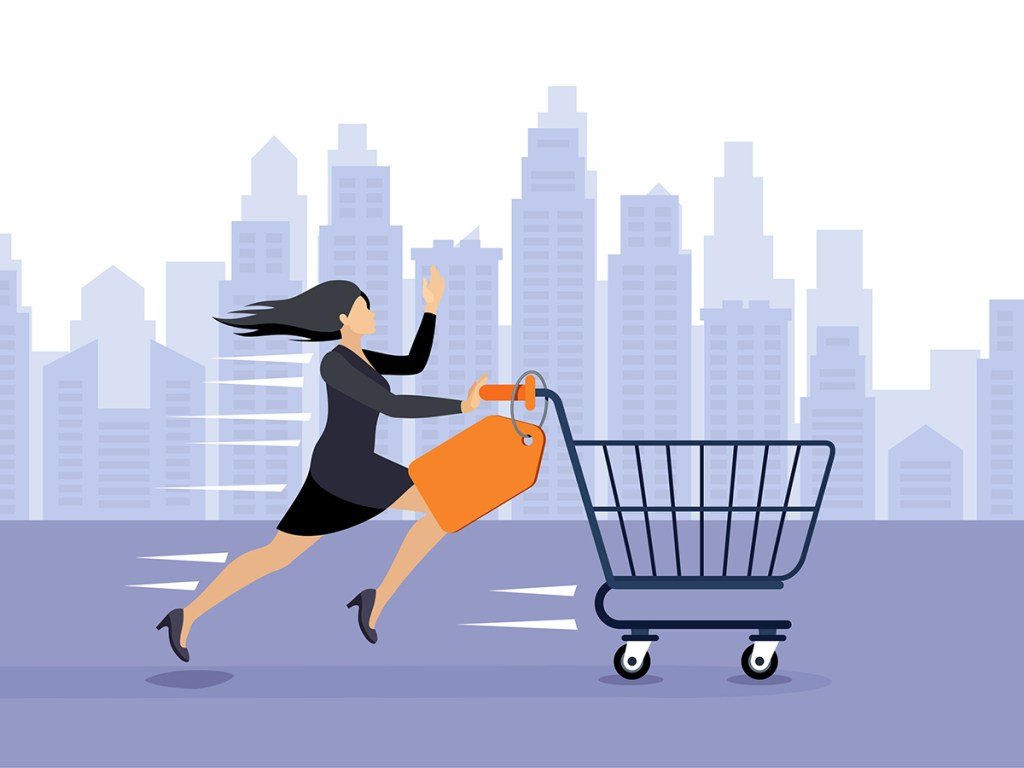 A Woman pushing a shopping cart to buy discounted items. Economy rising.
