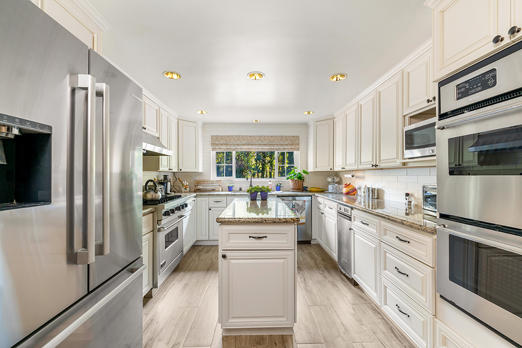 Kitchen | The Agency Journal Main house kitchen with doubel ovens, granite counter tops and island