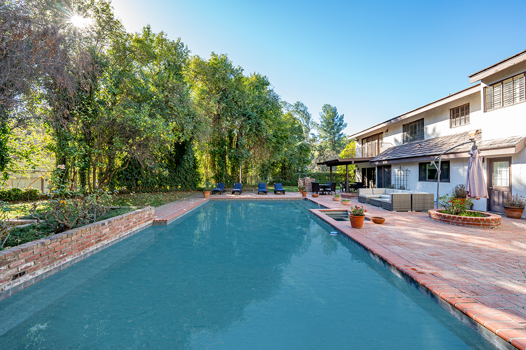 Long View of Swimming Pool | The Agency Journal Long view of the swimming pool with red brick patio