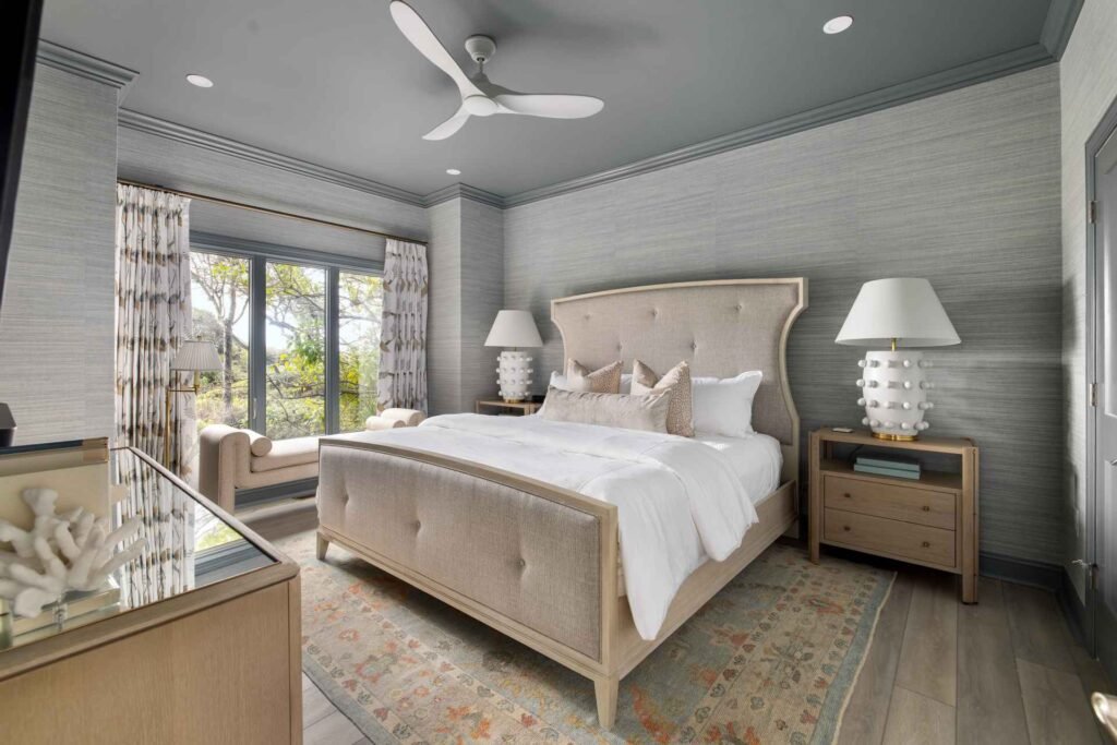 bedroom with light wood-type flooring, ceiling fan, and crown molding at 3518 Shipwatch Road, Kiawah Island, SC 29455