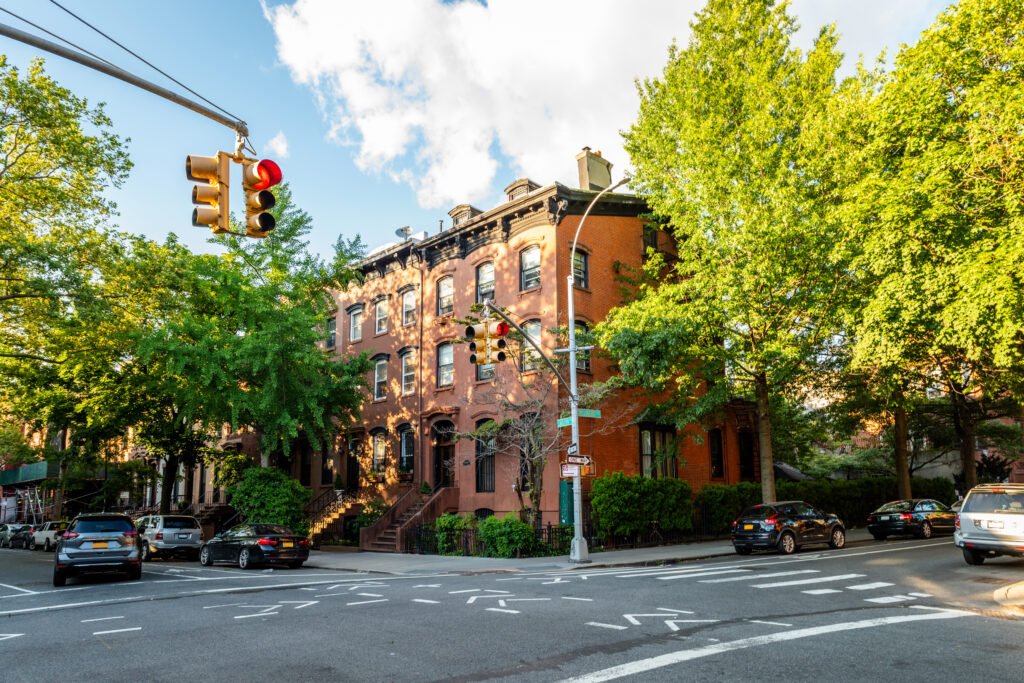 Clinton Hill, Brooklyn, United States - June 30, 2019: Historic brownstone building on beautiful summer evening in Clinton Hill, Brooklyn, New York.
