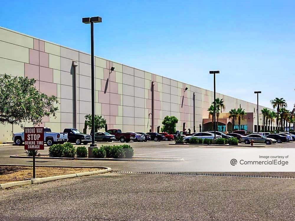 The 288,045 square feet industrial asset at 9860 West Buckeye Road in Tolleson, Ariz. The exterior shot shows a single-story industrial building and its parking lot.