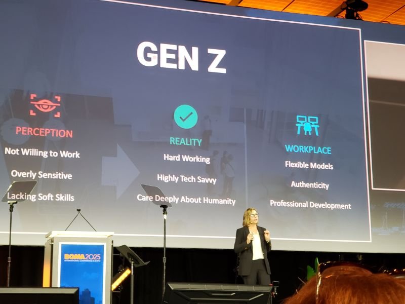 Oversized projected sign with Gen Z at top, woman standing in front