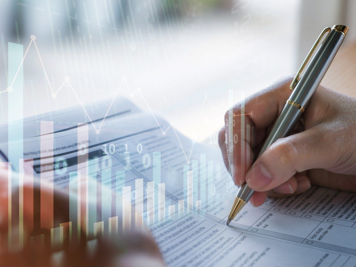 A hand filling out paperwork. Image by Jannoon028/iStockphoto.com