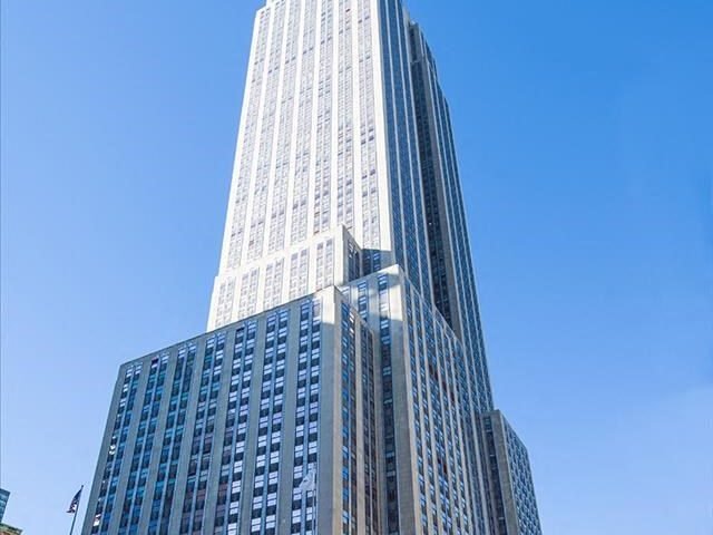Exterior shot of Empire State Building, an office tower in Manhattan.