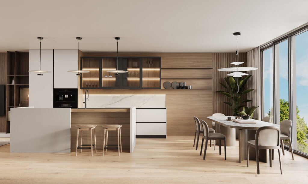 Open-plan kitchen and dining area with wood paneling, marble countertops, pendant lighting, and natural tones.