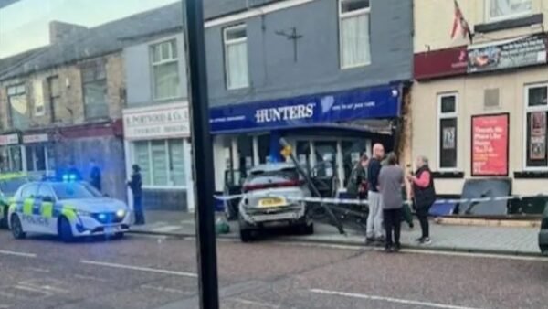 Car smashes into estate agency front – one person hospitalised