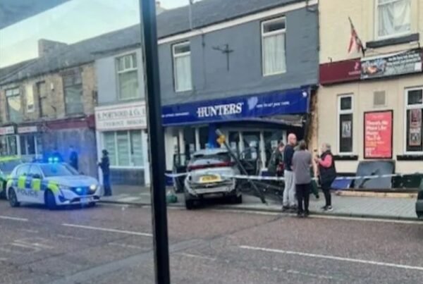Car smashes into estate agency front – one person hospitalised