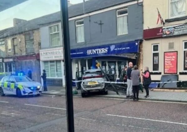 Car smashes into estate agency front – one person hospitalised