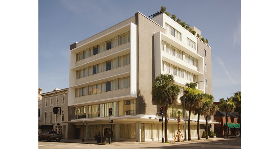 Exterior view of the Municipal Grand Hotel in Savannah, Georgia on a sunny day.