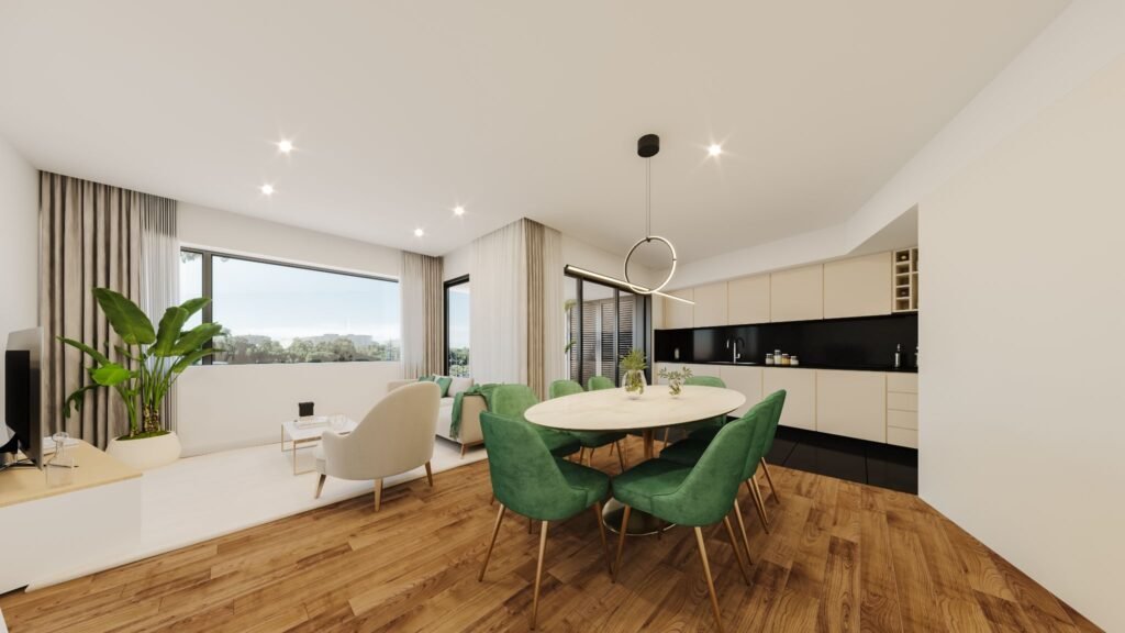 Contemporary open-plan dining and living space at Prisma Douro residences in Foz do Douro, Porto, featuring green velvet dining chairs, modern kitchen, and bright windows.