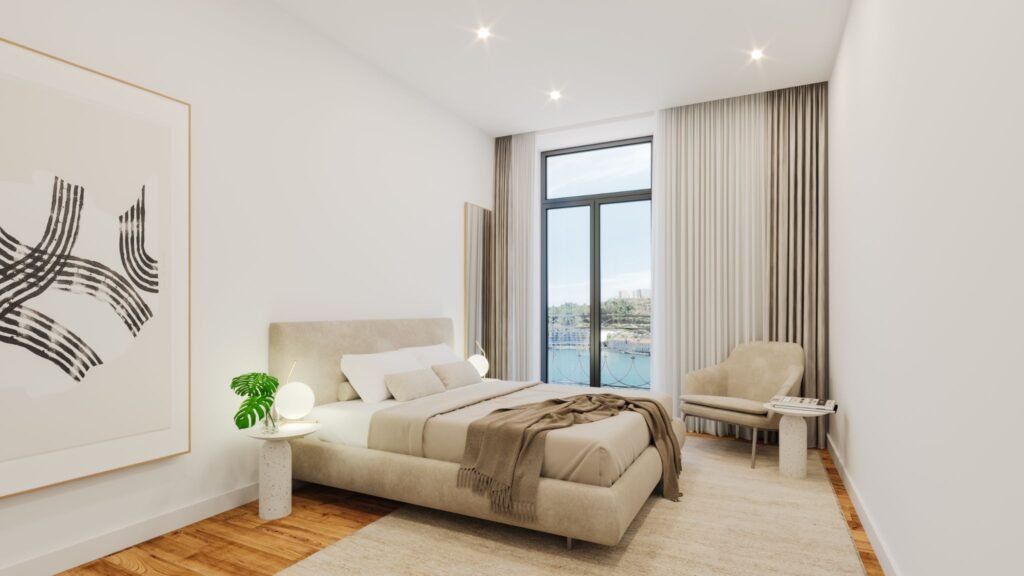 Spacious modern bedroom in a Prisma Douro apartment in Foz do Douro, Porto, featuring neutral decor, hardwood floors, and large windows with views of the Douro River.