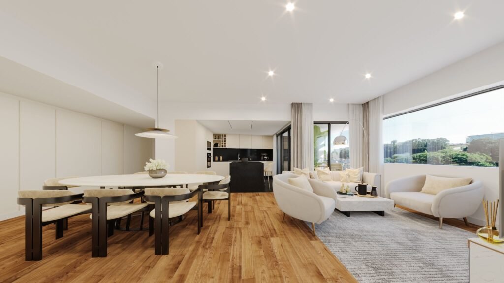 Modern open-concept living and dining area in a Prisma Douro luxury apartment in Porto's Foz do Douro, featuring high-quality finishes, hardwood floors, and a bright kitchen.
