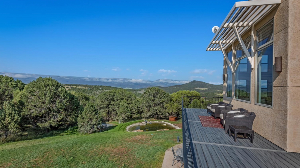 Elevated viewing deck with wicker chairs overlooking the mountain valley at Paradise Ridge in Carbondale Colorado.