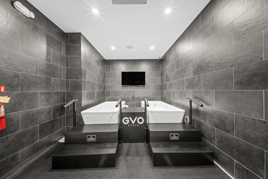 Commercial cold plunge therapy pools in the GVO Cycle wellness recovery room.