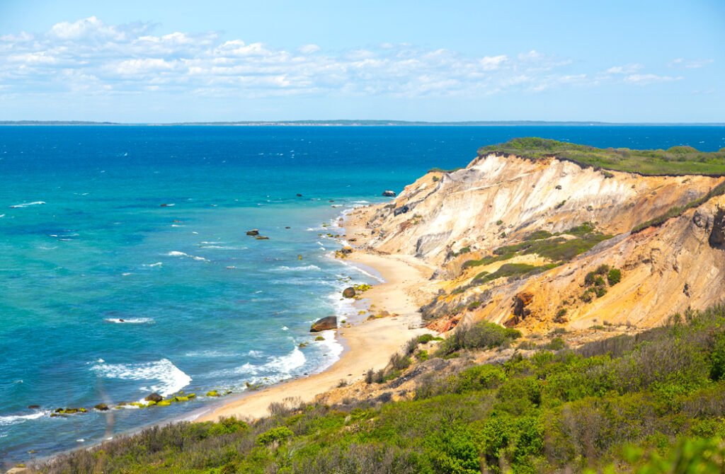 Panoramic view of the Martha’s Vineyard coastline and ocean views, highlighting the island's famous natural beauty and elite coastal real estate setting.