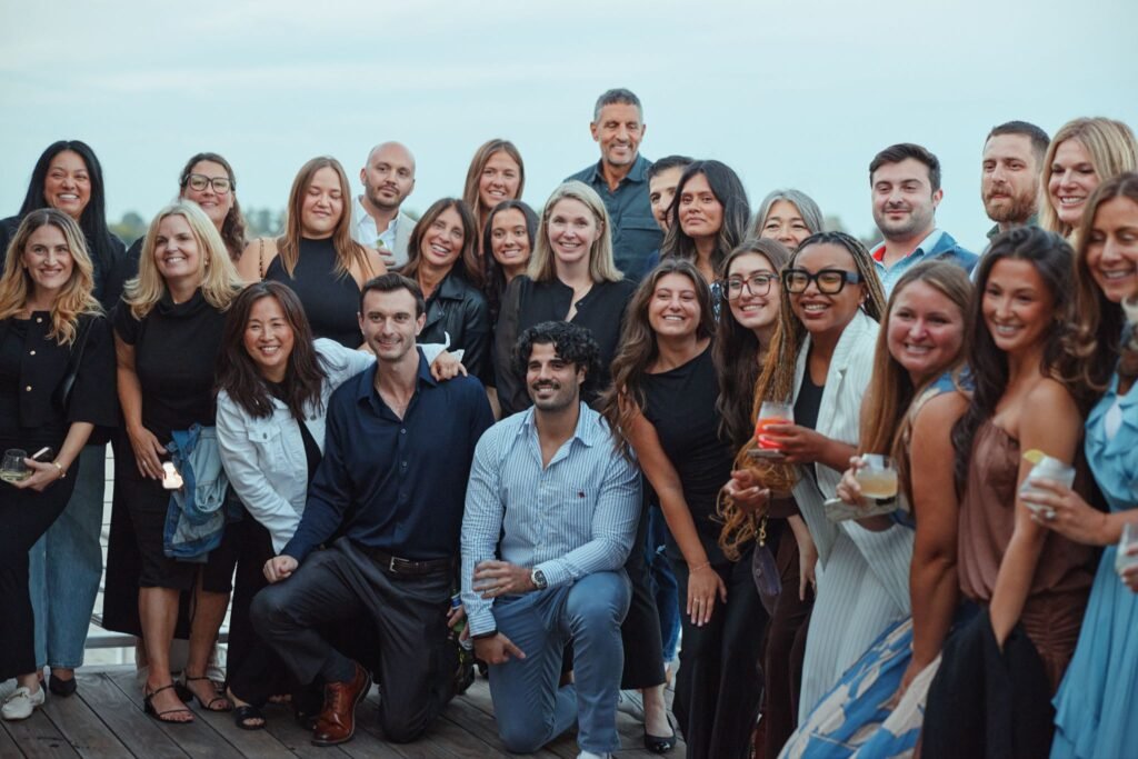 The Agency CEO Mauricio Umansky posing with corporate leadership and real estate agents at the cocktail reception for The Agency Fairfield's grand opening.