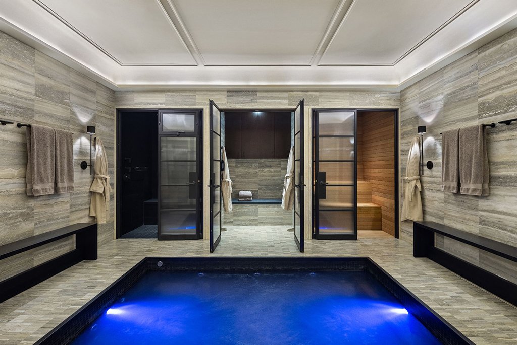 Subterranean cellar spa with Petit Granit-lined Jacuzzi plunge pool, steam room, and sauna at 165 East 70th Street townhouse.