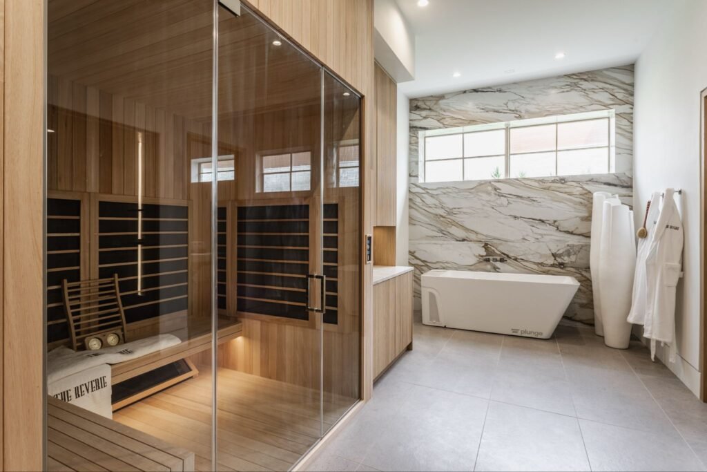 In-home luxury spa and water circuit at "The Reverie" estate in Zionsville, Indiana, featuring a custom glass infrared sauna and Plunge cold therapy tub