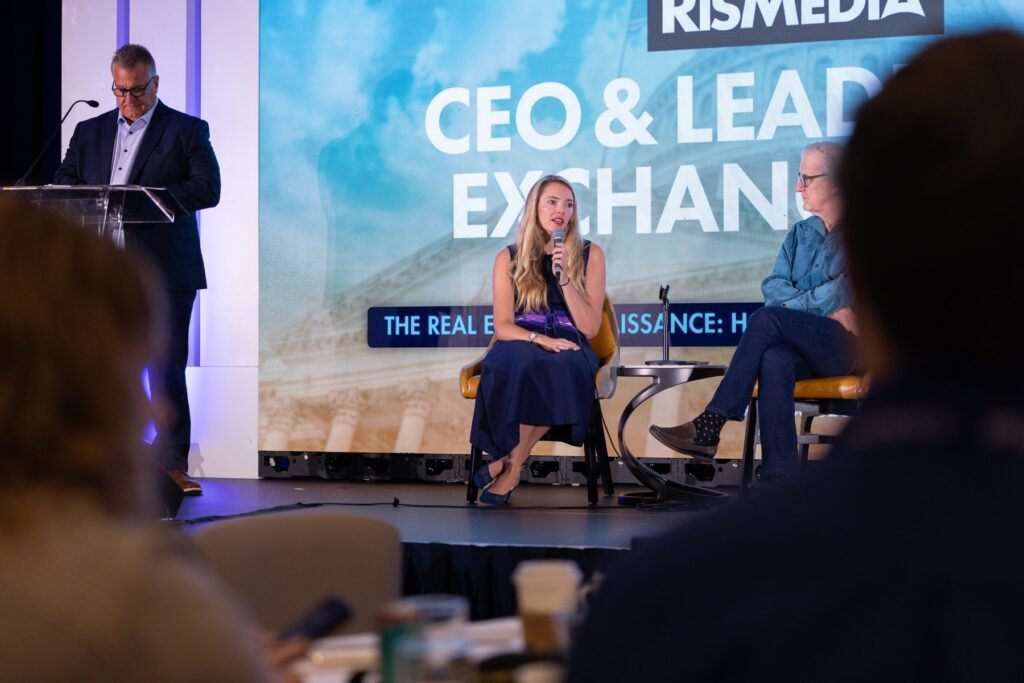 Laura Corrigan, Senior VP of Marketing at The Agency, speaking on stage at RISMedia's 2026 CEO & Leadership Exchange.